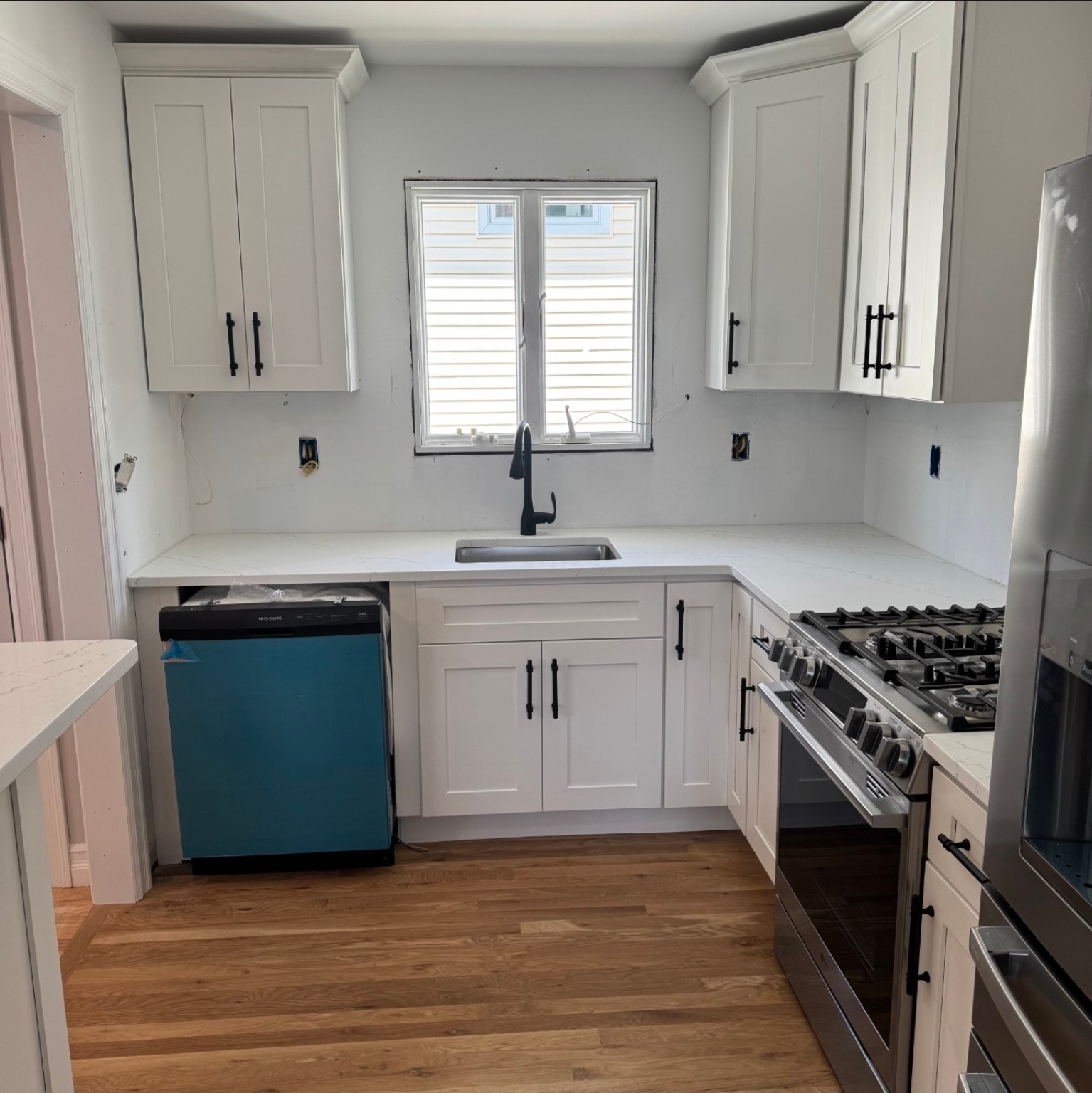 Completed compact white Shaker kitchen renovation